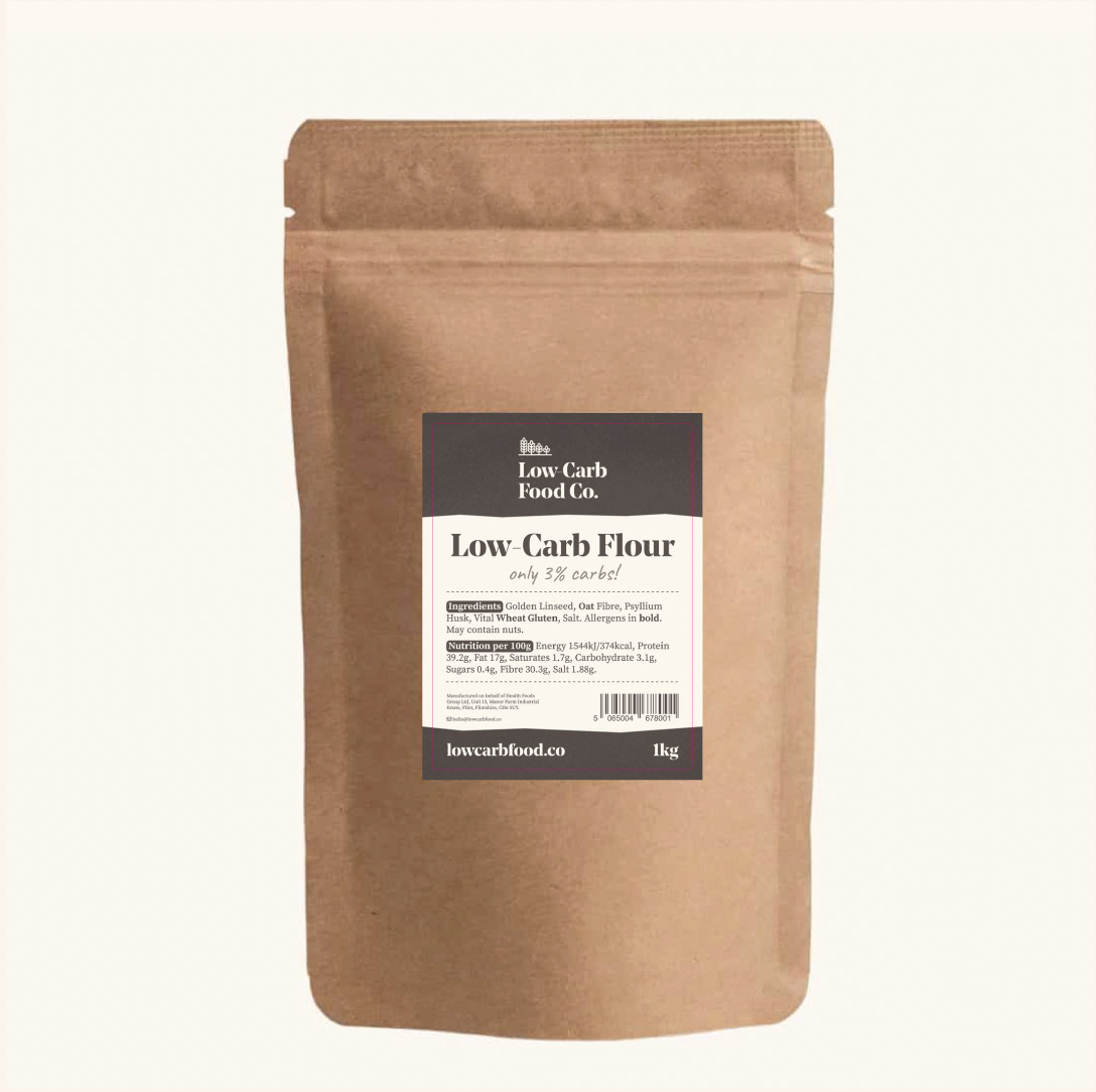 Brown kraft paper pouch of Low-Carb Food Co. flour with a dark label, showing 1kg weight.