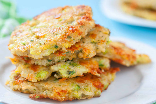 a stack of 5 low-carb fritters on a white porcelain plate